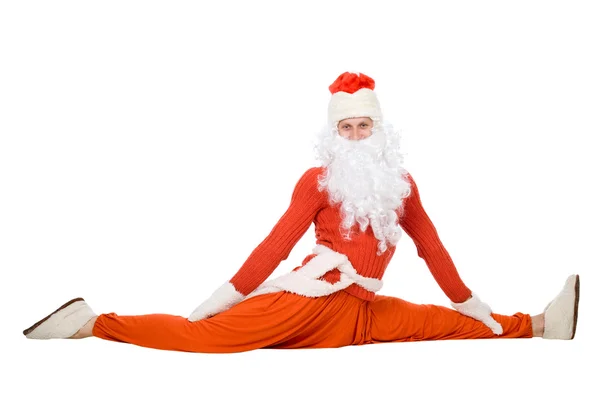 Santa Claus sits on a splits — Stock Photo, Image