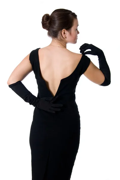 Vacker flicka i en klänning med en öppen rygg — Stockfoto