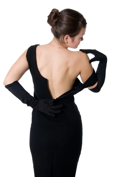 Vacker flicka i en klänning med en öppen rygg — Stockfoto