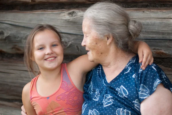 stock image The elderly woman with the grand daughter