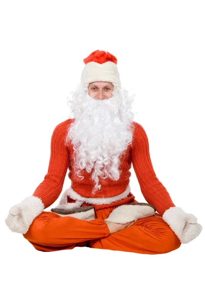 Weihnachtsmann sitzt auf halbem Bindfaden und dehnt — Stockfoto