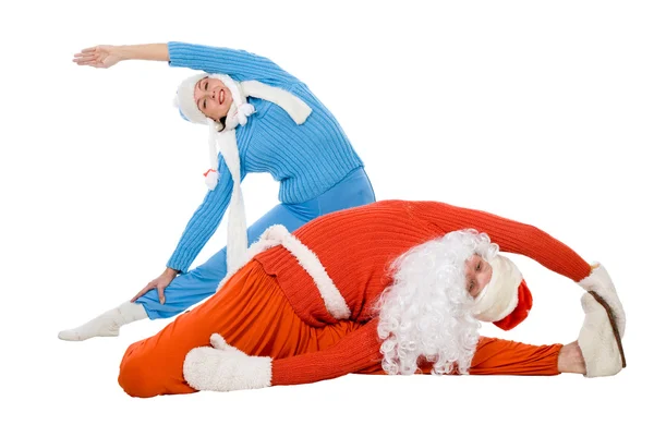 Weihnachtsmann und die Schneemädchen des Yoga — Stockfoto