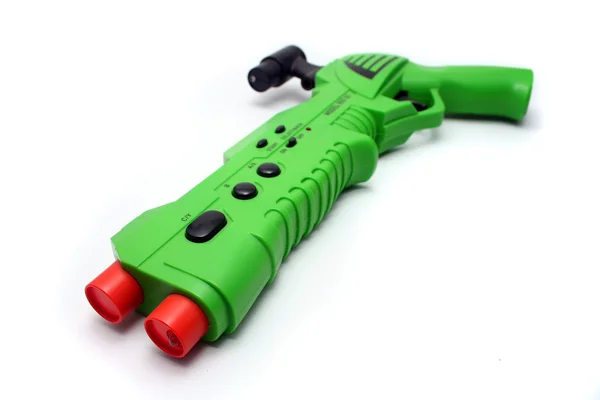 Contrôleur d'arme à feu de jeu vidéo vert sur blanc — Photo