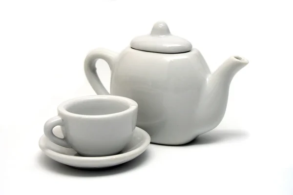 Bule branco isolado e xícara de chá — Fotografia de Stock