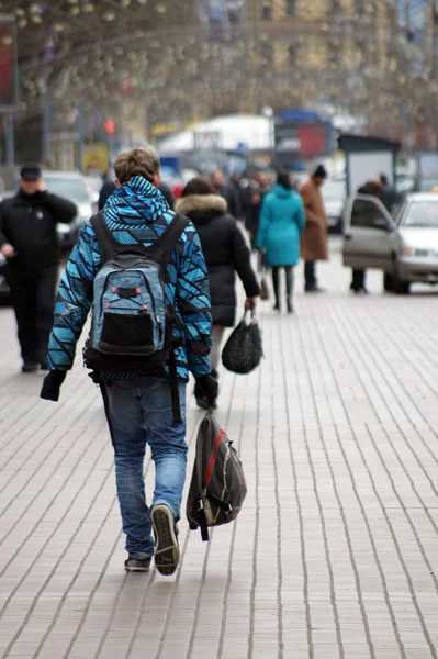 stock image The guy carries a backpack