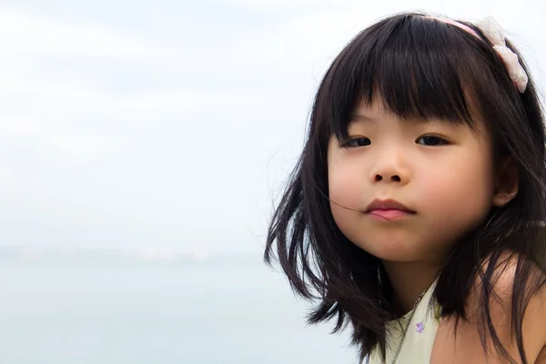 Kis-ázsiai lány portréja Stock Fotó