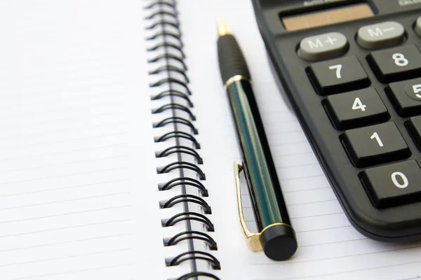 Stock image Note book with calculator and pen