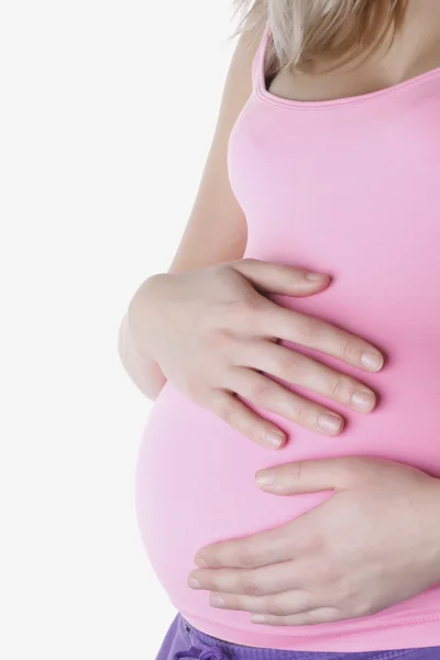 Wanita hamil memegang tangan di perutnya. — Stok Foto