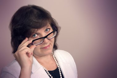 Mature woman with glasses
