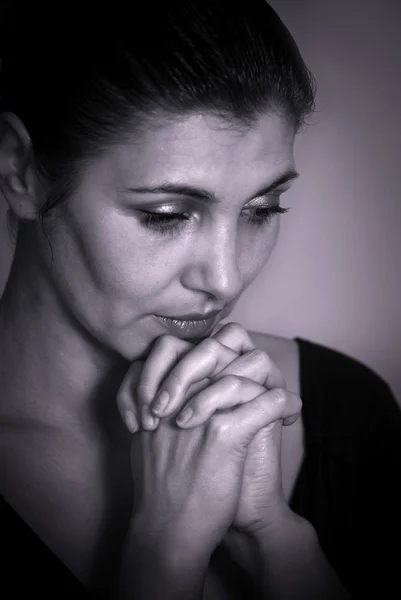 Mujer rezando Imagen de stock
