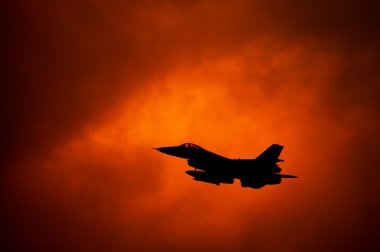 F-16 on orange sky clipart