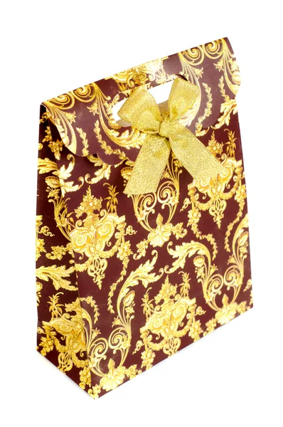 Geschenk tas met gouden en rood ornament — Stockfoto