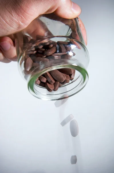 Pouring out Pills — Stockfoto