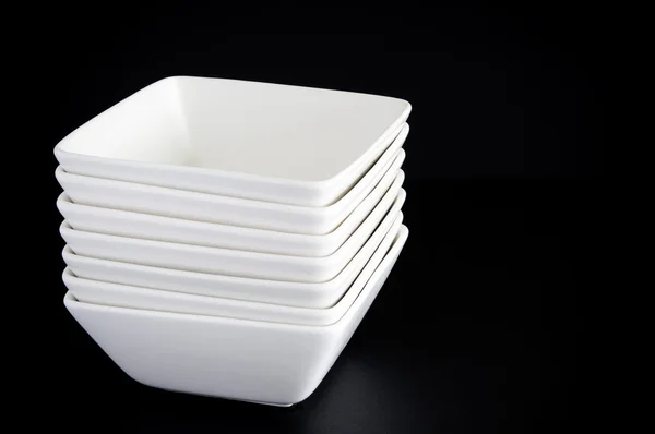 White Bowls on Black — Stockfoto