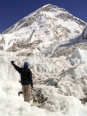 Hiker stands in the Khumbu clipart