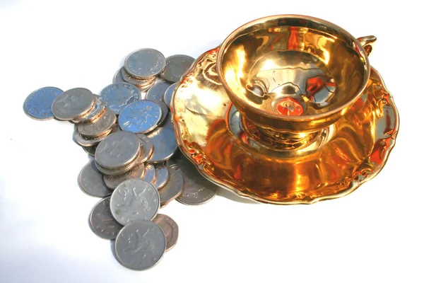 Gold cup and silver coins — Stock Photo, Image