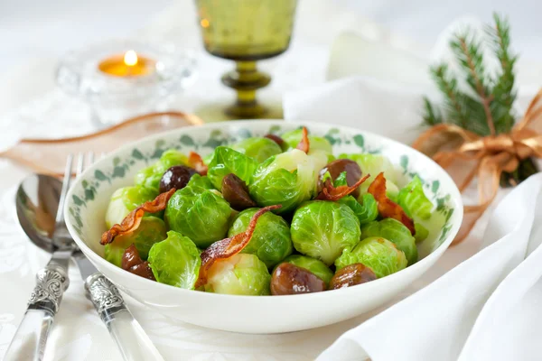 Brussels sprouts with bacon and chestnuts — Stock Photo, Image