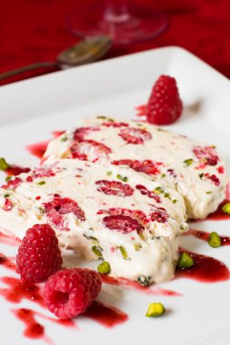 Semifreddo with raspberry and pistachios clipart