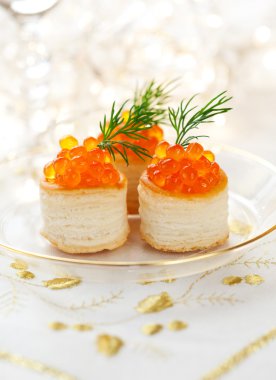 Vol-au-vents filled with red caviar clipart