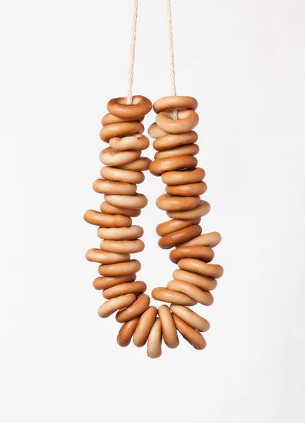 Sheaf of bagels, a bunch of bagels on a white background — Stock Photo, Image