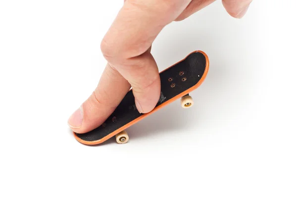 Mão no skate de brinquedo — Fotografia de Stock