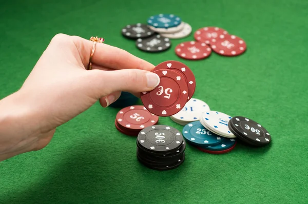 Womans hand holding poker chips — Stock Photo, Image