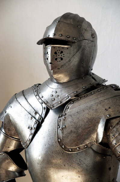 Closeup of a medieval knight's suit of armor and helmet
