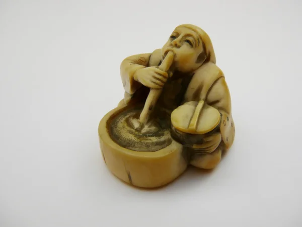 Estatueta minúscula de um fumante de ópio — Fotografia de Stock