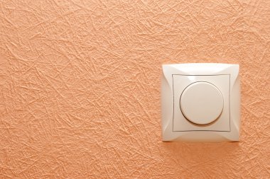 Button-switch on a wall clipart