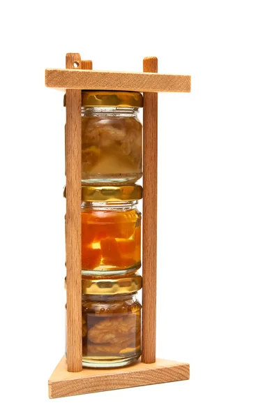 Honung med nötter i en pyramid — Stockfoto