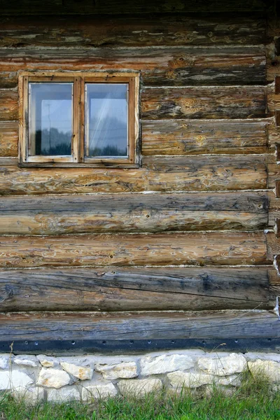 stock image Wall of log house with window