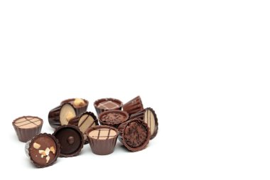 Mixed Chocolates on white with copy space clipart