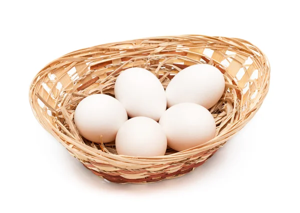 Hen's eggs in a basket — Stock Photo, Image
