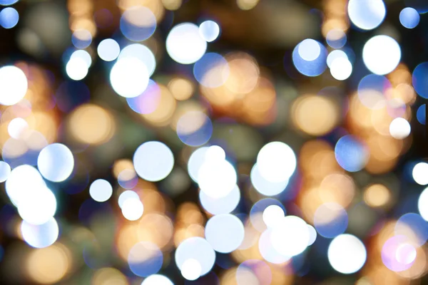 Verschwommene Weihnachtsbeleuchtung. Hintergrund der Feiertage — Stockfoto