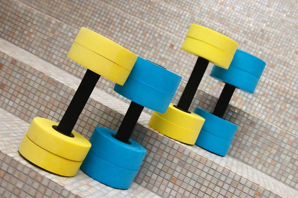 Four dumbbells for water aerobics — Stock Photo, Image