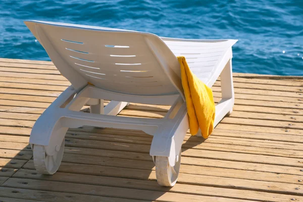 Lounge chair near the sea — Stock Photo, Image