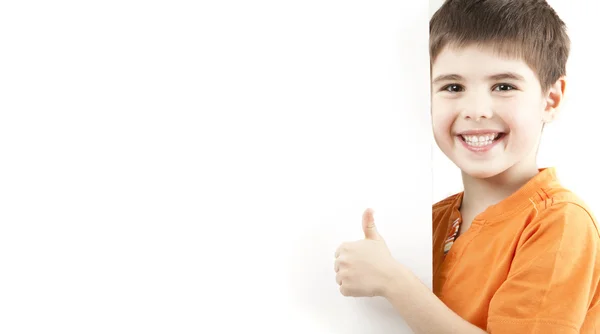 Smiling boy showing thumb — Stock Photo, Image