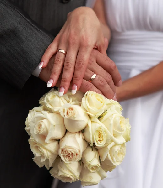 Holding a wedding bouquet — Stock Photo, Image