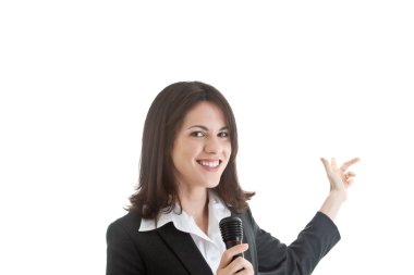 Caucasian Woman Holding Microphone Pointing Behind White Backgro clipart