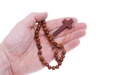 Hand Holding Rosary Cross Isolated White clipart