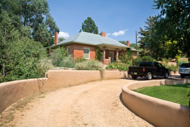 Brick Home Santa Fe, New Mexico Gravel Drive Adobe Wall clipart