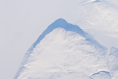 Aerial View Snow and Ice Covered Cliff Baffin Island, Canada clipart