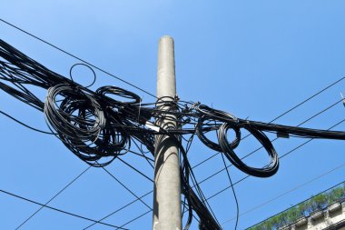 Mass of Telephone Electrical Wires On Cement Pole Shanghai China clipart