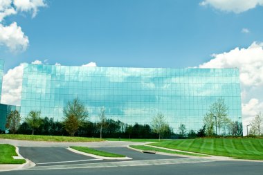 Ultra Modern Mirrored Glass Office Building in Maryland Blue Sky clipart