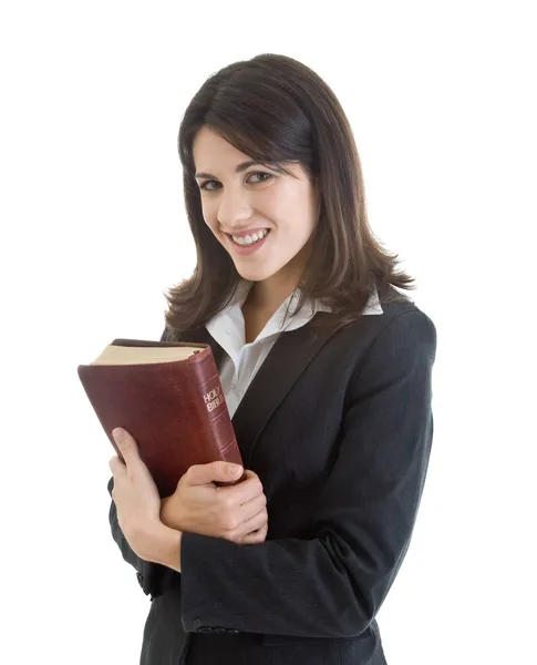 Χαμογελαστό γυναίκα, κρατώντας Αγία Γραφή στενά απομονωθεί λευκό — Φωτογραφία Αρχείου