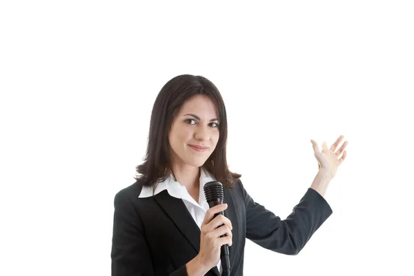 Kobieta trzyma mikrofon wskazując, na białym tle biały — Zdjęcie stockowe