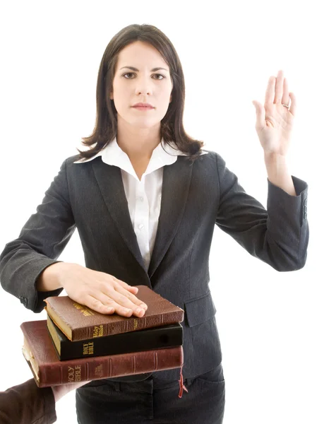 Caucasian Woman Swearing on Stack of Bibles Isolated White Backg — Stock Photo, Image