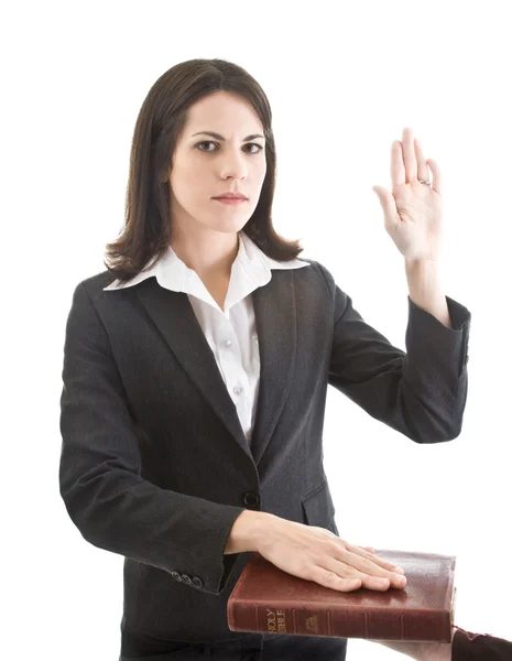 Caucasian Woman Swearing on a Bible Isolated White Background — Stock Photo, Image