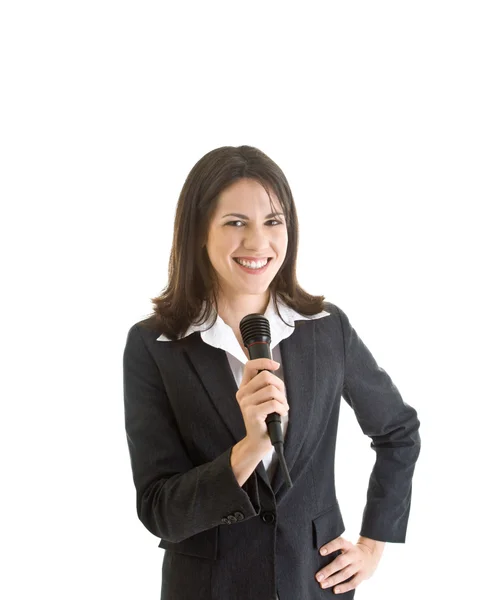 Sonriente mujer de negocios caucásica sosteniendo micrófono inalámbrico Whi — Foto de Stock