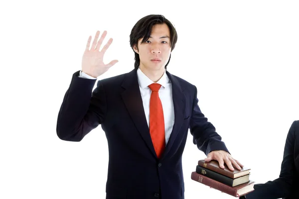 Business Man Swearing Stack of Bibles, Isolated — Stock Photo, Image